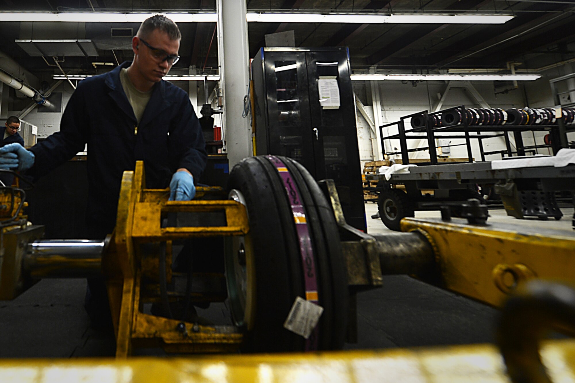 U.S. Air Force Airman 1st Class William Miller, 20th Equipment Maintenance Squadron wheel and tire team member, uses an F-16CM Fighting Falcon bead breaker at Shaw Air Force Base, S.C., Feb. 27, 2018.