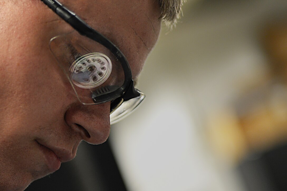 U.S. Air Force Airman 1st Class William Miller, 20th Equipment Maintenance Squadron wheel and tire team member, uses an F-16CM Fighting Falcon bead breaker at Shaw Air Force Base, S.C., Feb. 27, 2018.