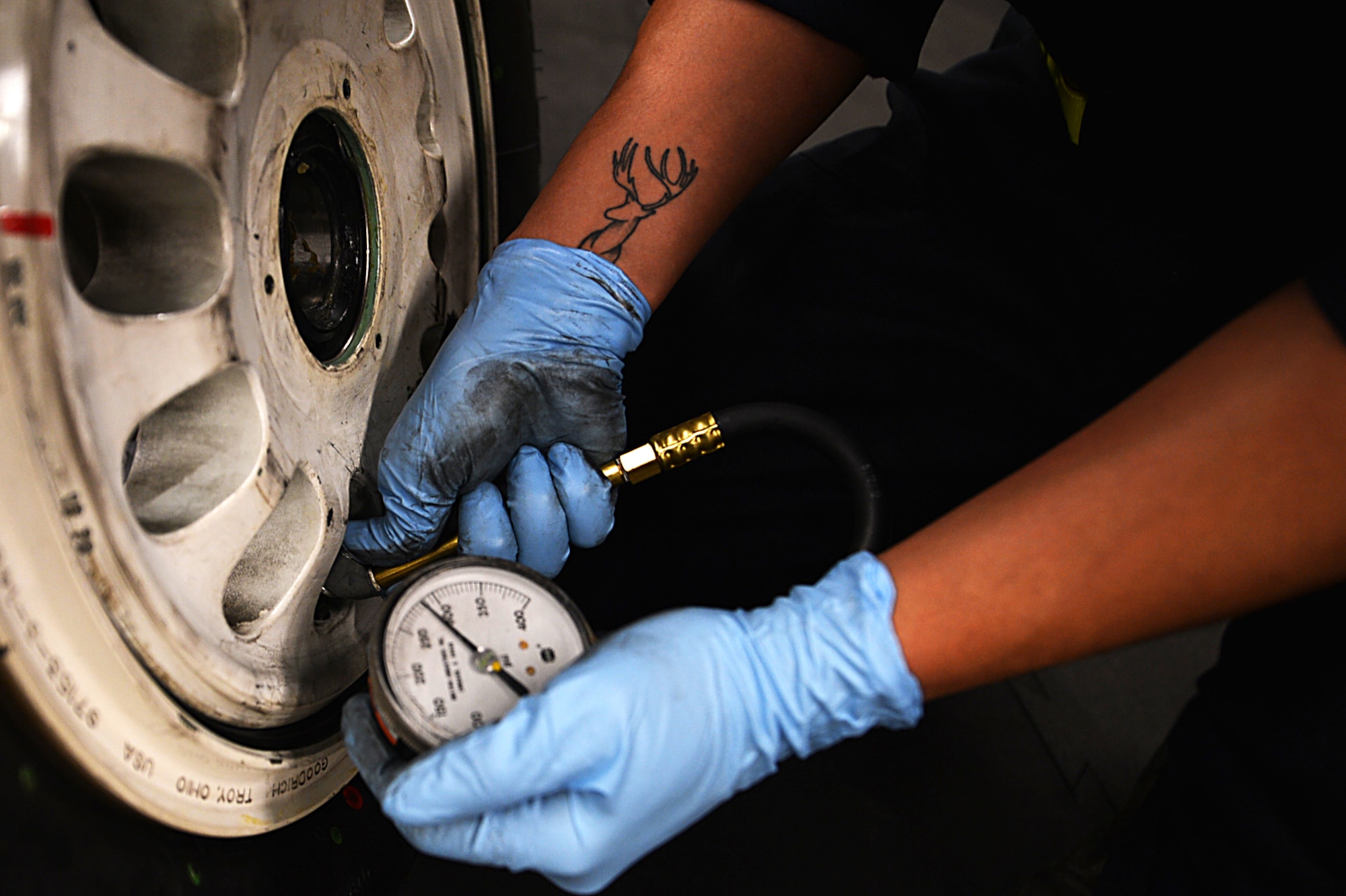 U.S. Air Force Airman 1st Class William Miller, 20th Equipment Maintenance Squadron wheel and tire team member, uses an F-16CM Fighting Falcon bead breaker at Shaw Air Force Base, S.C., Feb. 27, 2018.
