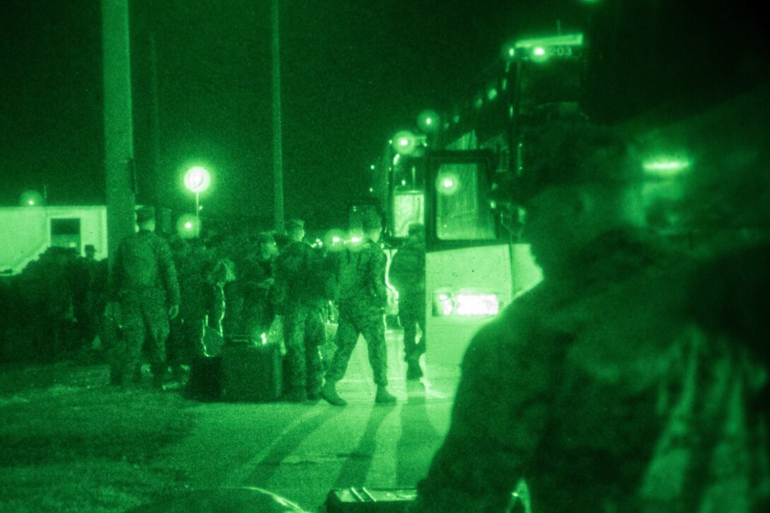 U.S. Marines with the 26th Marine Expeditionary Unit (MEU), offload gear from buses prior to boarding the amphibious assault ship USS Iwo Jima (LHD 7) at Naval Station Mayport, Fla., Feb. 6, 2017. The 26th MEU is deploying at sea to conduct maritime security operations, crisis response and theater security cooperation, while also providing a forward expeditionary naval presence in Europe and the Middle East. (U.S. Marine Corps photo by Cpl. Jered T. Stone)