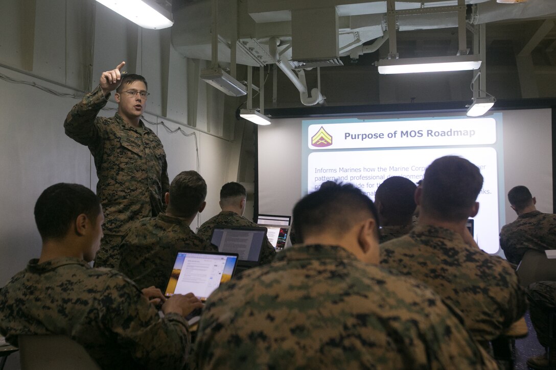 U.S. Marine Corps Sgt. Christopher J. Chandler, left, a squad leader with Battalion Landing Team, 2nd Battalion, 6th Marine Regiment (BLT 2/6), 26th Marine Expeditionary Unit (MEU), teaches a class during corporal’s course aboard the amphibious assault ship USS Iwo Jima (LHD 7), Feb. 13, 2018. The Marines participated in corporal’s course as part of a period of military education to further develop the skills and knowledge of noncommissioned officers. (U.S. Marine Corps photo by Cpl. Jered T. Stone)