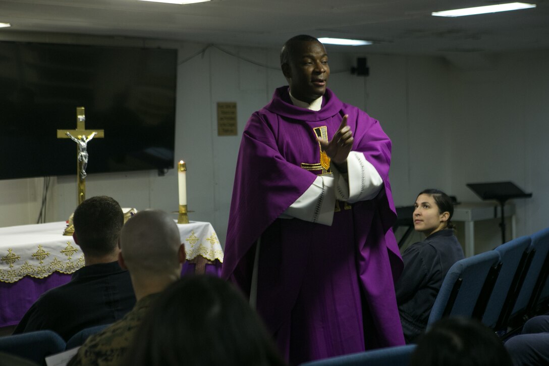 U.S. Navy Lt. Donelson Thevenin, the chaplain of Battalion Landing Team, 2nd Battalion, 6th Marine Regiment (BLT 2/6), 26th Marine Expeditionary Unit (MEU), gives a sermon during an Ash Wednesday service aboard the amphibious assault ship USS Iwo Jima (LHD 7), Feb. 14, 2018. Ash Wednesday is considered the first day of Lent, a time of reflection and penitence in anticipation of Easter Sunday. (U.S. Marine Corps photo by Cpl. Jered T. Stone)