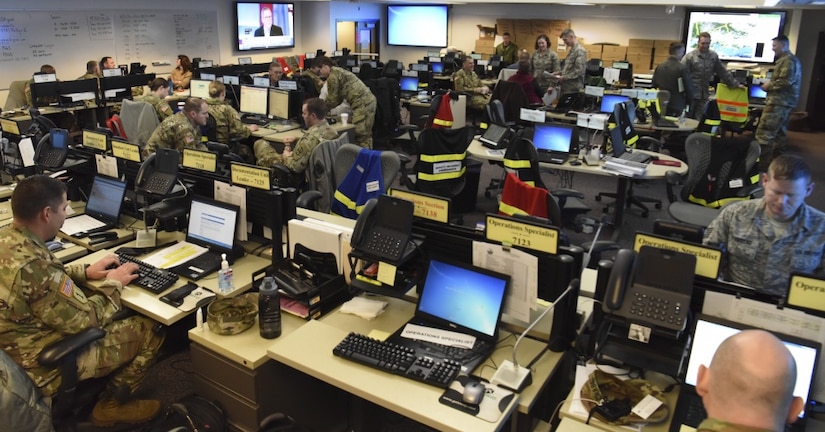 National Guard troops and Defense Department civilians and contractors work together at Alaska National Guard Joint Force Headquarters, Joint Base Elmendorf-Richardson, Alaska, during Exercise Arctic Eagle 2018, Feb. 24, 2018. Air National Guard photo by Senior Master Sgt. Paul Mann