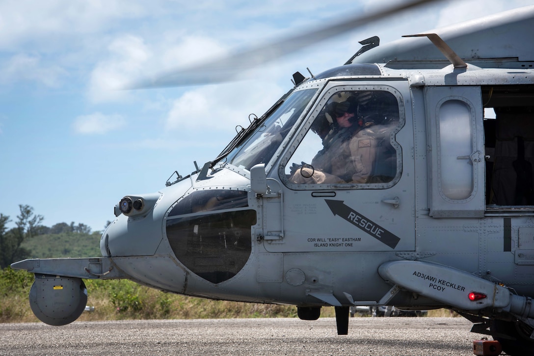 A Navy MH-60S Seahawk helicopter waits to refuel.