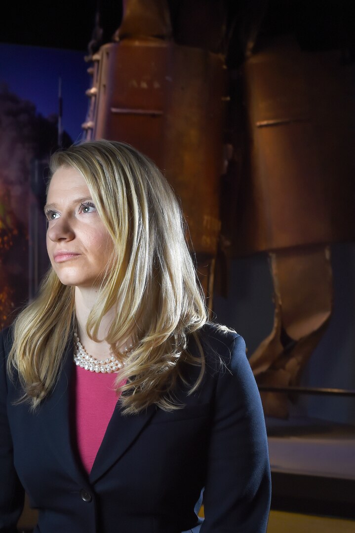 Miranda Summers Lowe, the curator of modern military history at the Smithsonian Institution, sits in front of a section of the World Trade Center on display in the Smithsonian’s National Museum of American History.