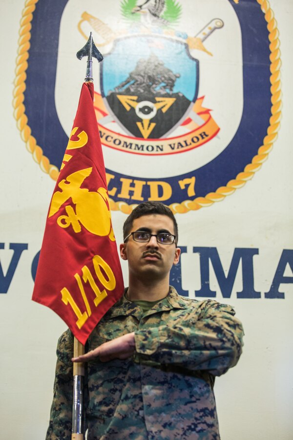 ATLANTIC OCEAN (February 21, 2018) U.S. Marine Corps Cpl. Abraham A. Diaz, a Reconfigurable Transportable Consolidated Automated Support System (RTCASS) technician with Marine Medium Tiltrotor Squadron (VMM) 162 (Reinforced), 26th Marine Expeditionary Unit, renders a salute during guidon drill as part of Corporals Course aboard the amphibious assault ship USS Iwo Jima (LHD 7), Feb. 21, 2018. The Marines participated in Corporals Course as part of a period of military education to further develop the skills and knowledge of noncommissioned officers while underway. (U.S. Marine Corps photo by Cpl. Jered T. Stone/Released)