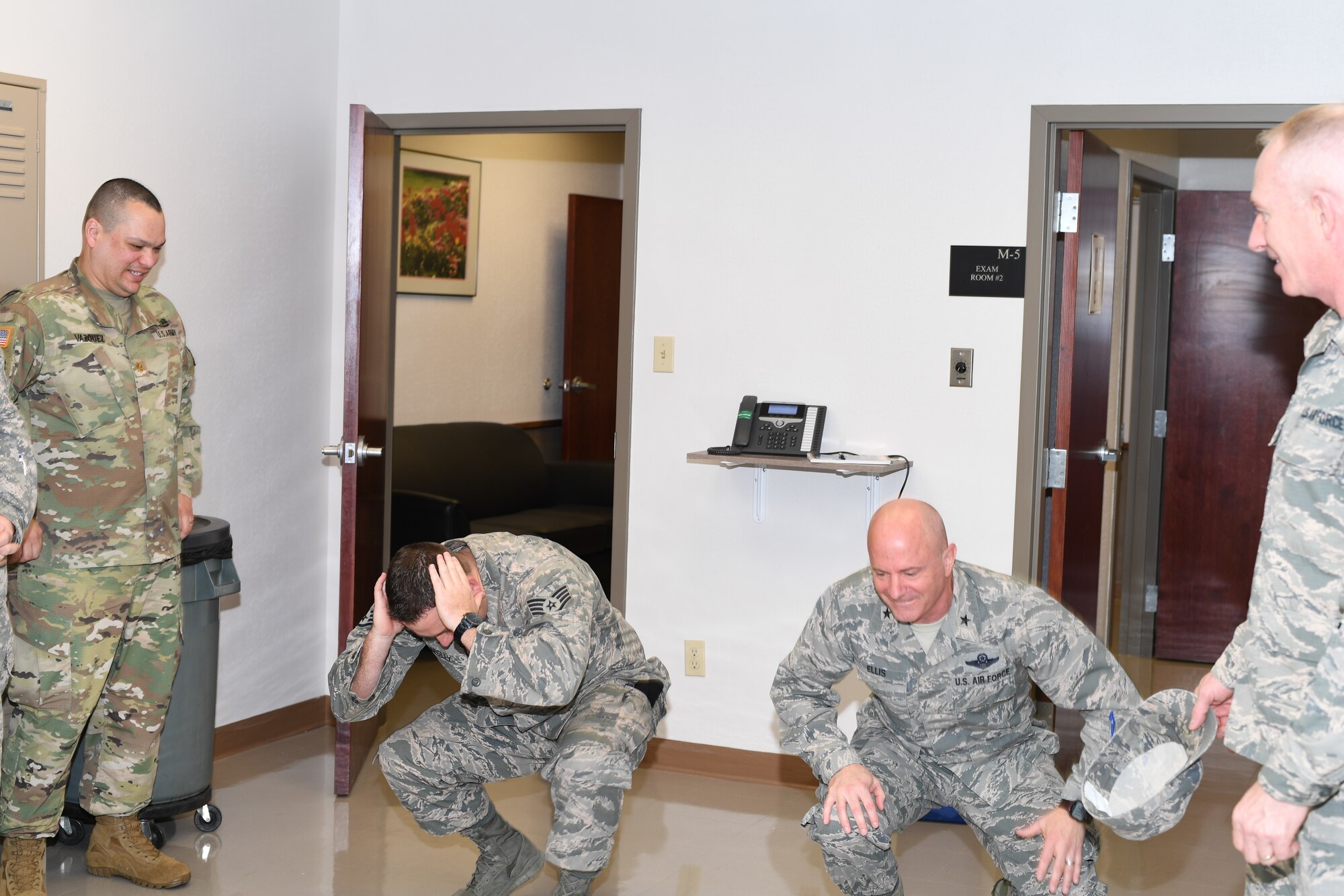 Eighth Air Force members do the "duck walk" at the local MEPS