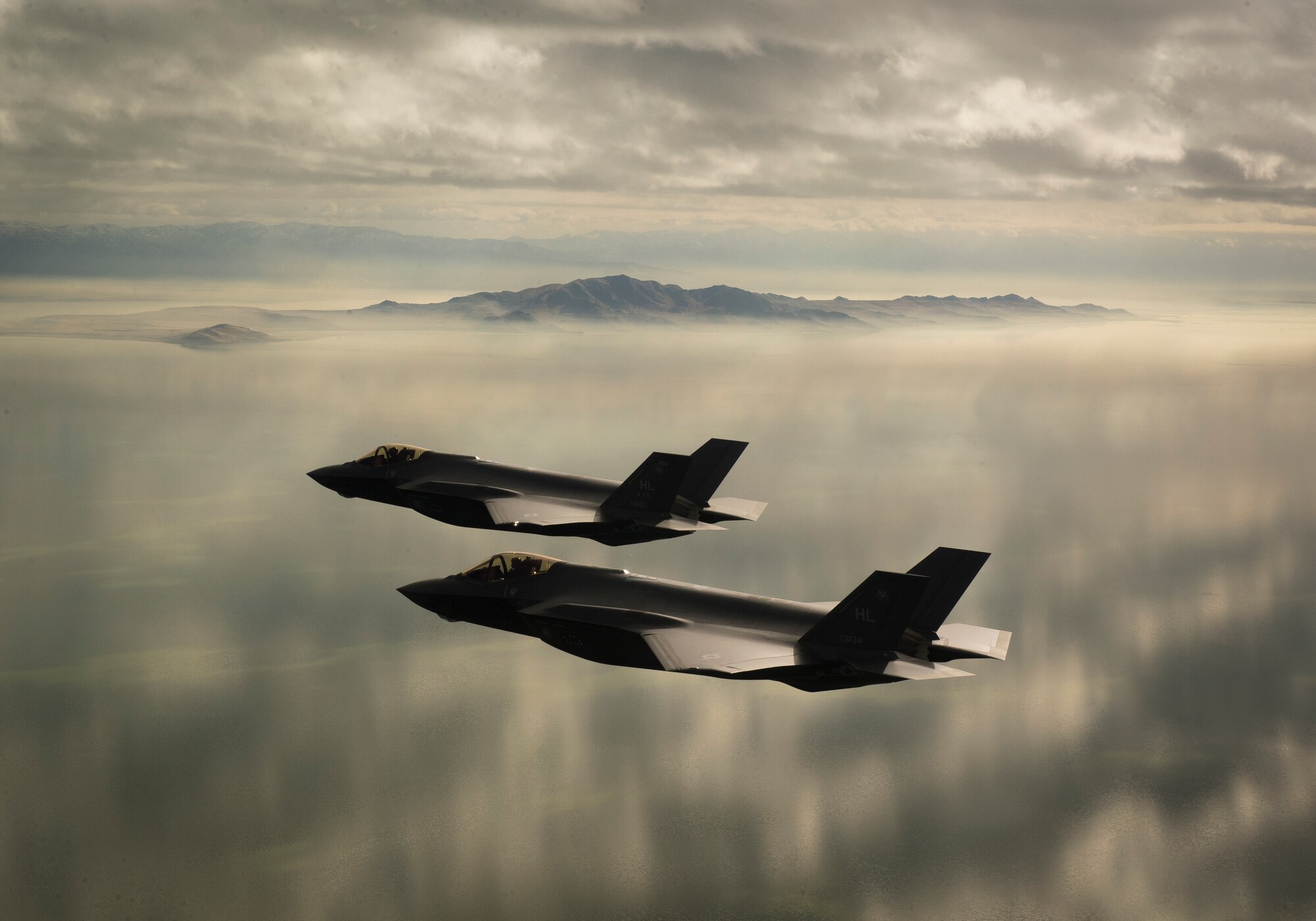 Two F-35A Lightning IIs, assigned to the 4th Fighter Squadron from Hill Air Force Base, Utah, conduct flight training operations over the Utah Test and Training Range on Feb 14, 2018. The F-35A is a single-seat, single engine, fifth generation, multirole fighter that’s able to perform ground attack, reconnaissance and air defense missions with stealth capability. (U.S. Air Force photo by Staff Sgt. Andrew Lee)