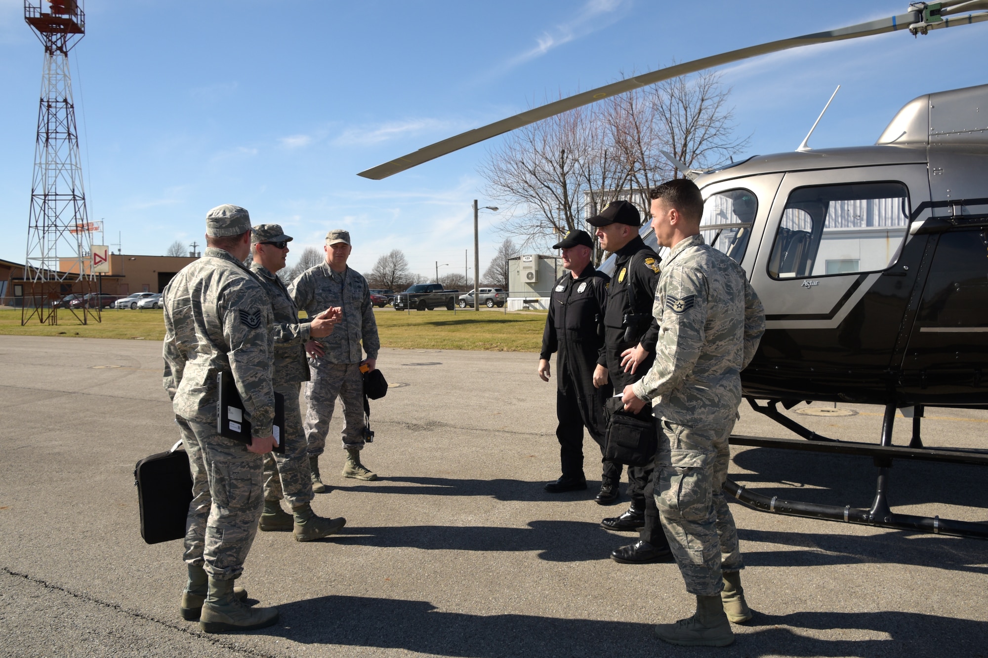 Nearly 10 Airmen with the 178th Wing team up with the Ohio State Highway Patrol Aviation Department to provide flood relief assistance for several counties in the tri-state area, Ohio, Feb. 27, 2018. The birds-eye view imagery provided detailed information for emergency agencies to effectively provide relief to the damaged areas. The 178th Airmen were able to leverage their technological skills with the Ohio State Patrolmen’s knowledge of the layout of the land to get help to Ohioans where it is needed most. (U.S. Air National Guard photo cleared for public release)