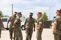 MSgt James J. Fuentes the Military Police Course Chief gives the Commandant of the Marine Corps a tour of one of the Military Police training areas on Fort Leonard Wood, MO August 28th, 2017. As the Military Police Course Chief, MSgt Fuentes is responsible for the day to day operations, he is in charge of 300 entry level students and 32 Military Police Instructors. (U.S. Marine Corps photo by Sgt. Teng Yang)