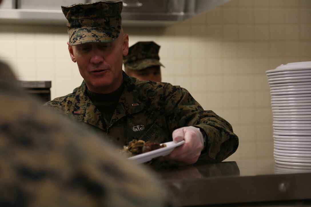 Chief Warrant Officer 5 Steven F. Spark, Chemical Biological Radiological Nuclear Company Commander, also assist in serving meals for the Marine Corps Detachment Fort Leonard Wood Student population. (U.S. Marine Corps photo by Sgt. Teng Yang)