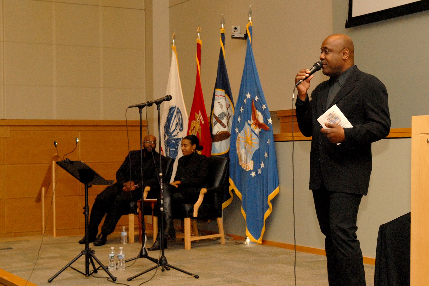 Key Arts Productions’ Joe Patterson (right) introduces a video presentation of African-Americans in times of war at Defense Logistics Agency Troop Support in Philadelphia on Feb. 28.