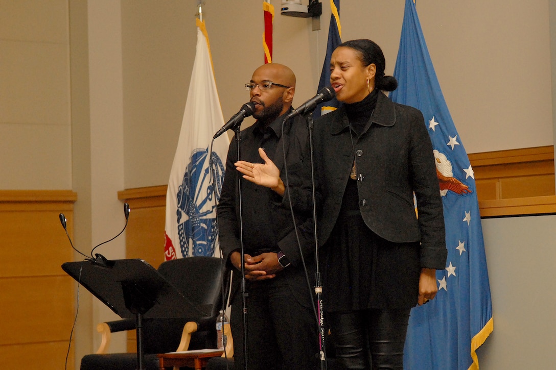 Key Arts Productions’ vocalists Nathan Harmon (left) and Veronica Menyweather (right) sing during a presentation of African-Americans in times of war at Defense Logistics Agency Troop Support in Philadelphia on Feb. 28.