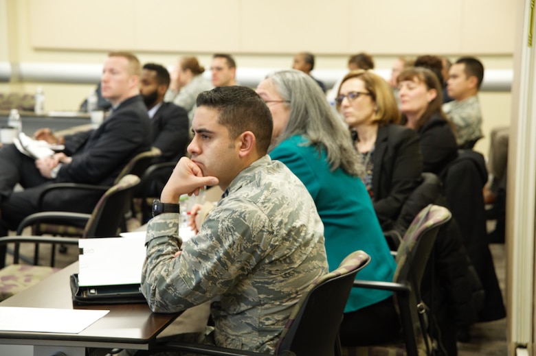 Military and civilian attendees listen to discussions during the Air Force District of Washington Financial Management and Comptroller Conference in the Smart Conference Center here March 1, 2018