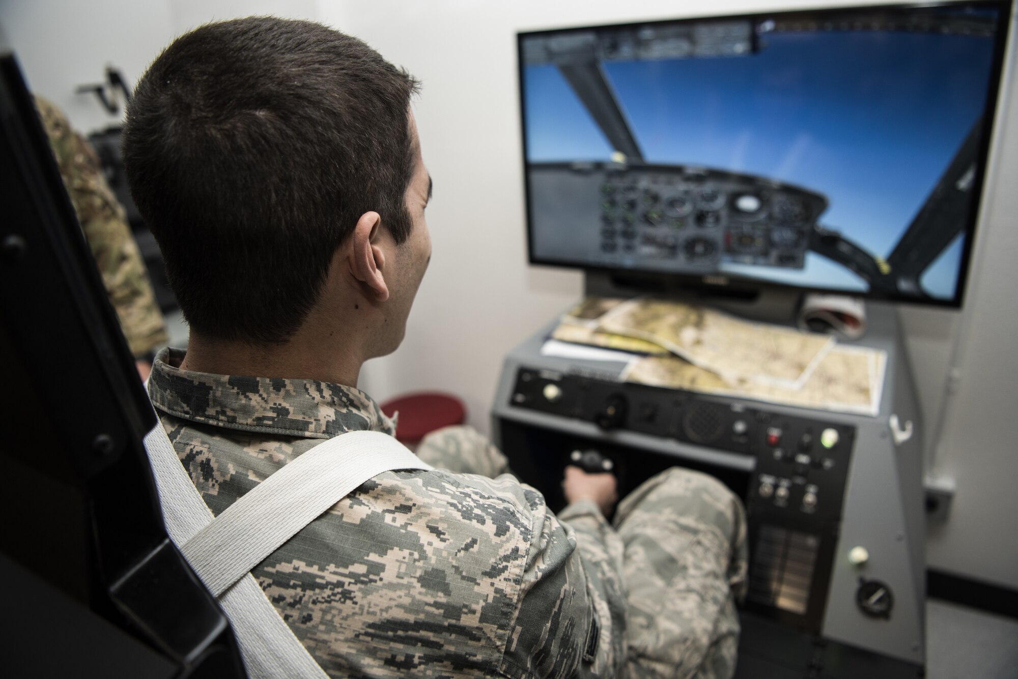 Senior Airman Andrew Kasmedo, 90th Munitions Squadron maintenance team member, flies a helicopter simulation while visiting 90th Medicals Group Aerospace and Operational Physiology during the Mission  Immersion Day at F.E. Warren Air Force Base, Wyo., Feb. 27, 2018. The Airmen were able to get an inside look at the dangers of hypoxia and how the Aerospace and Operational Physiology team works to educate the pilots on the warning signs and how to react to the situation. The Mission Immersion Day was put together to allow Airmen the opportunity to exercise cross communication between the different career fields on base.  (U.S. Air Force photo by Airman 1st Class Abbigayle Wagner)