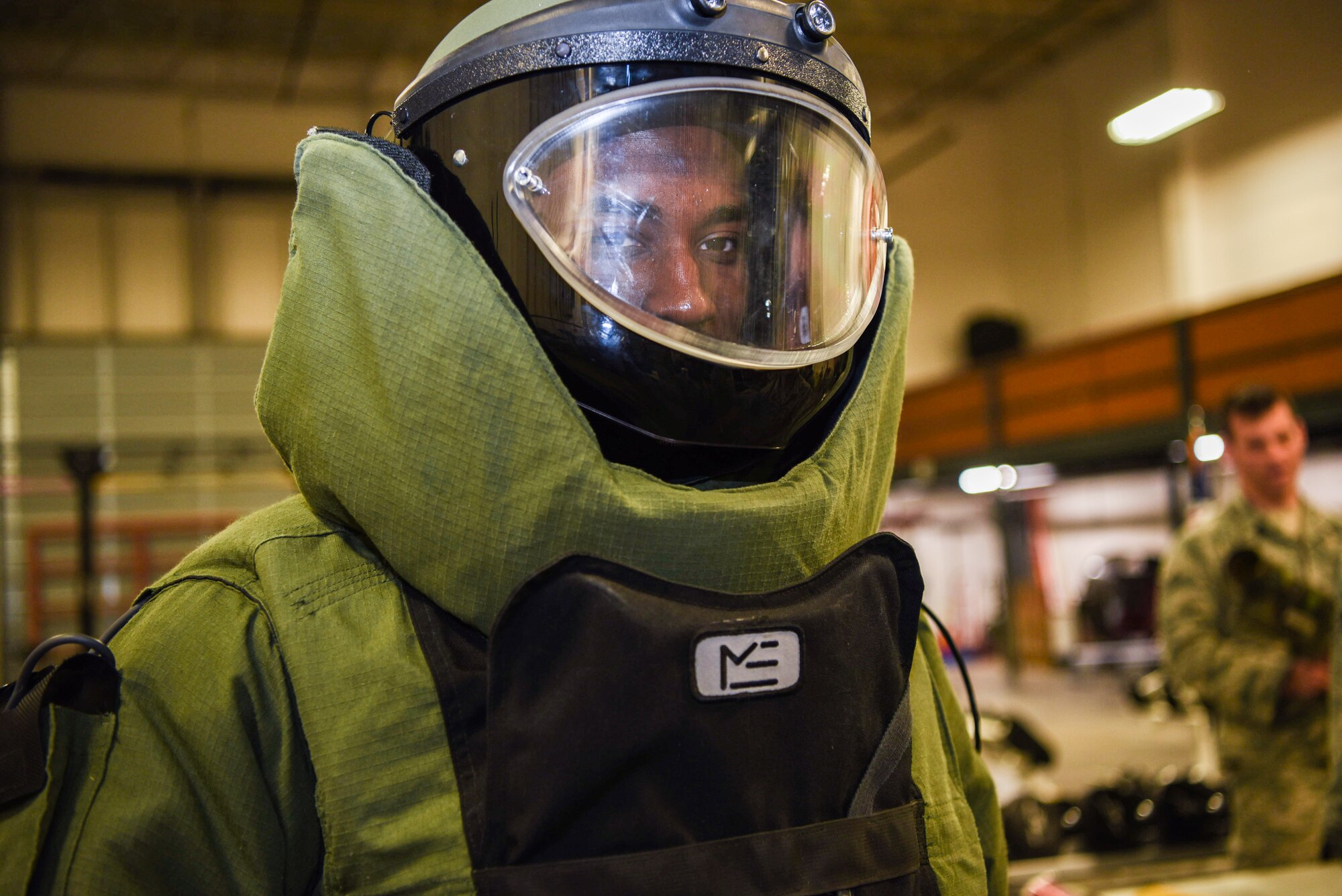 Senior Airman Markus Matthews, 90th Security Forces Group defender, tries on a blast suit while visiting the 90th Civil Engineering Squadron’s Explosive Ordnance Disposal section during the Mission Immersion Day at F.E. Warren Air Force Base, Wyo., Feb. 27, 2018. The Airmen got a hands on look of the training tools used to prepare the EOD team for possible situations. The Mission Immersion Day was put together to allow Airmen the opportunity to exercise cross communication between the different career fields on base.  (U.S. Air Force photo by Airman 1st Class Abbigayle Wagner)
