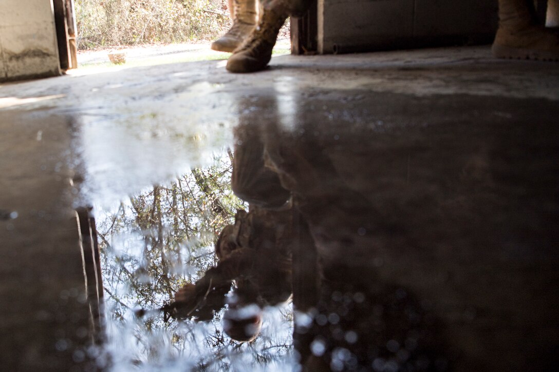 Airmen from the 824th Base Defense Squadron enter a building during close-quarters battle training, Feb. 28, 2018, at Moody Air Force Base, Ga. The 820th Base Defense Group welcomed a member of the British Royal Air Force to embed into multiple training situations to help strengthen combined operations between U.S. and British forces. (U.S. Air Force photo by Senior Airman Daniel Snider)
