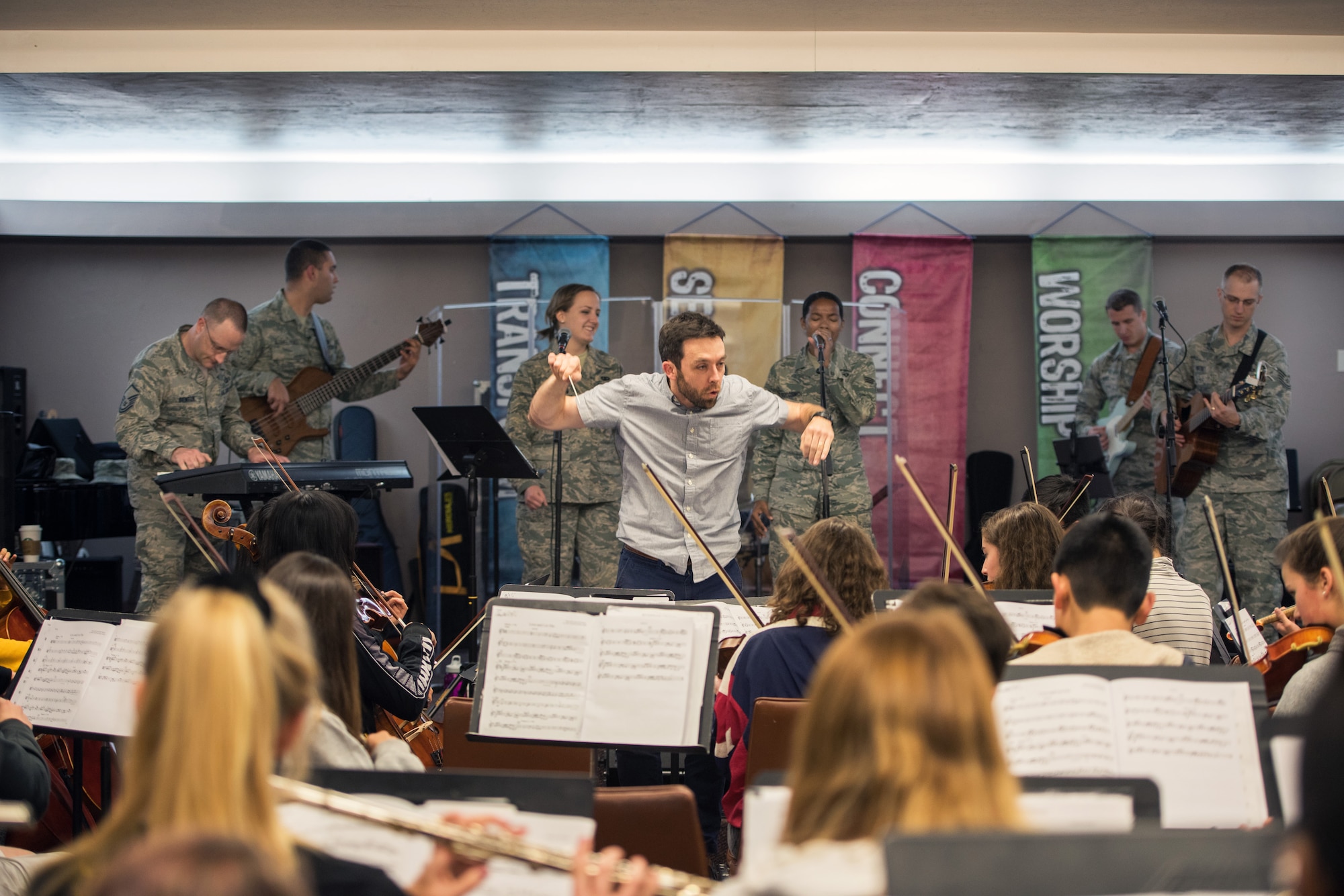 Musicians from the rock music group “Mobility” of The United States Air Force Band of the Golden West, Travis Air Force Base, Calif., practice with the Napa Valley Youth Symphony at the Napa Christian Academy, Napa, Calif., Feb. 25, 2018. The band and symphony are practicing together for an upcoming performance. The original performance, scheduled in October 2017, was canceled due to devastating wildfires in Napa and Sonoma counties. (U.S. Air Force photo by Louis Briscese)