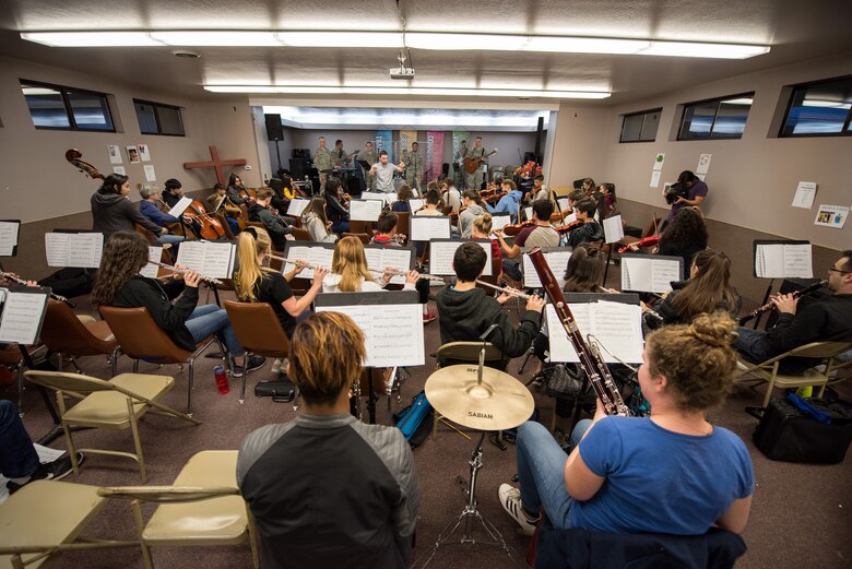 Musicians from the rock music group “Mobility” of The United States Air Force Band of the Golden West, Travis Air Force Base, Calif., practice with the Napa Valley Youth Symphony at the Napa Christian Academy, Napa, Calif., Feb. 25, 2018. The band and symphony are practicing together for an upcoming performance. The original performance, scheduled in October 2017, was canceled due to devastating wildfires in Napa and Sonoma counties. (U.S. Air Force photo by Louis Briscese)