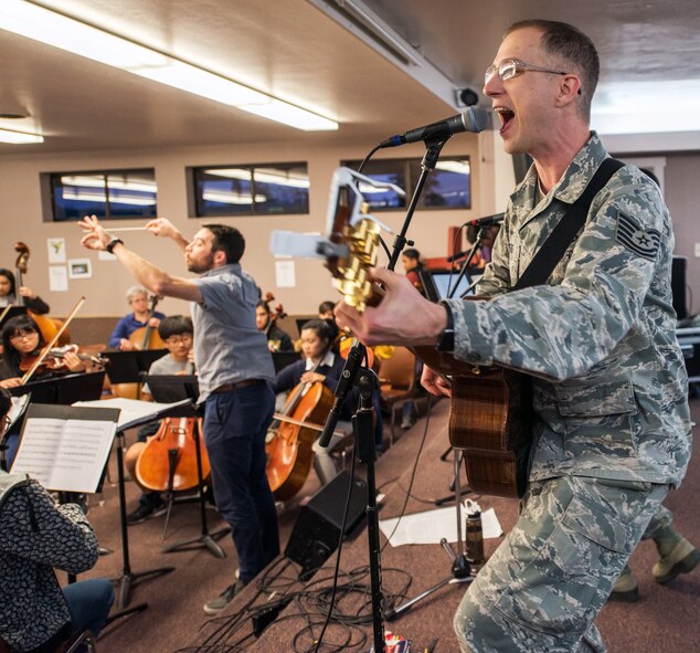 Musicians from the rock music group “Mobility” of The United States Air Force Band of the Golden West, Travis Air Force Base, Calif., practice with the Napa Valley Youth Symphony at the Napa Christian Academy, Napa, Calif., Feb. 25, 2018. The band and symphony are practicing together for an upcoming performance. The original performance, scheduled in October 2017, was canceled due to devastating wildfires in Napa and Sonoma counties. (U.S. Air Force photo by Louis Briscese)