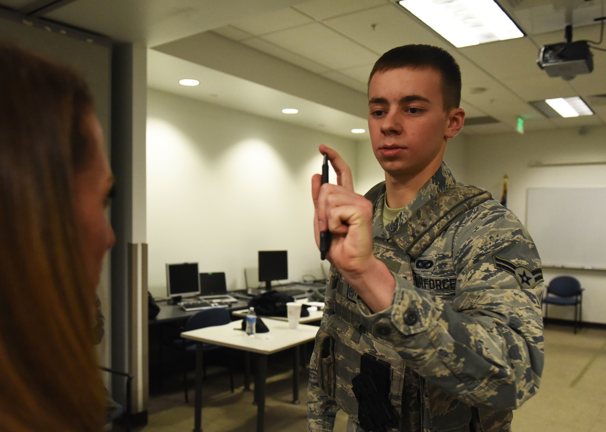 Airman 1st Class Seth Slater, 460th Security Forces Squadron patrolman, performs a horizontal gaze nystagmus test on the subject of a Standardized Field Sobriety Training, Feb. 12, 2018, on Buckley Air Force Base. The test measures the involuntary jerking of the eye, which can increase when an individual is intoxicated. It is one of the nationally recognized field sobriety tests. (U.S. Air Force photo by Senior Airman AJ Duprey)