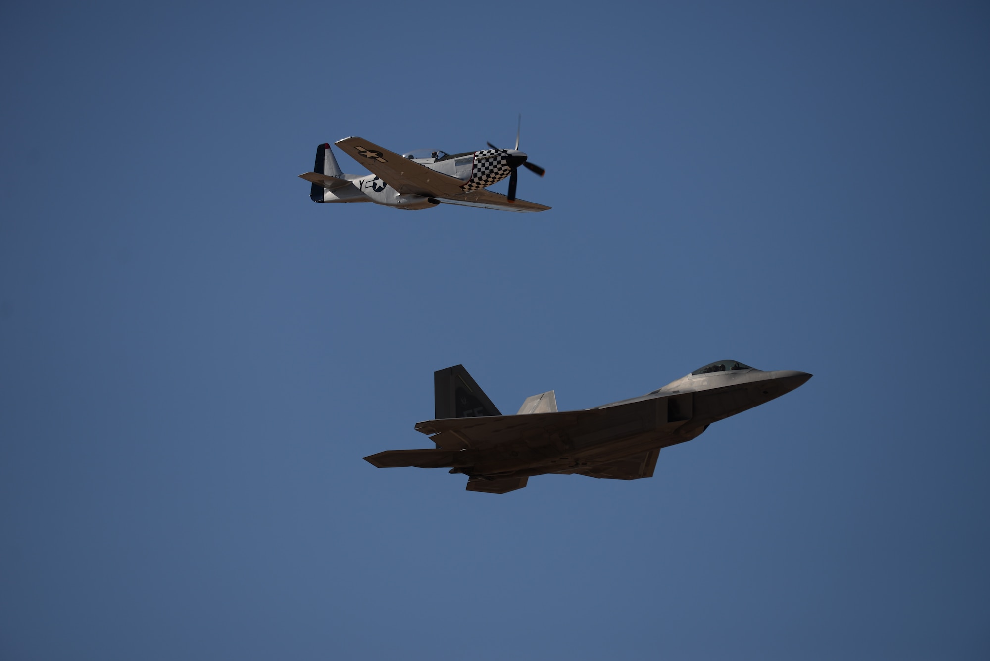 During the annual Heritage Flight Training and Certification course, aircrews practice ground and flight training to enable civilian pilots of historic military aircraft and U.S. Air Force pilots of current fighter aircraft to fly safely in formations together