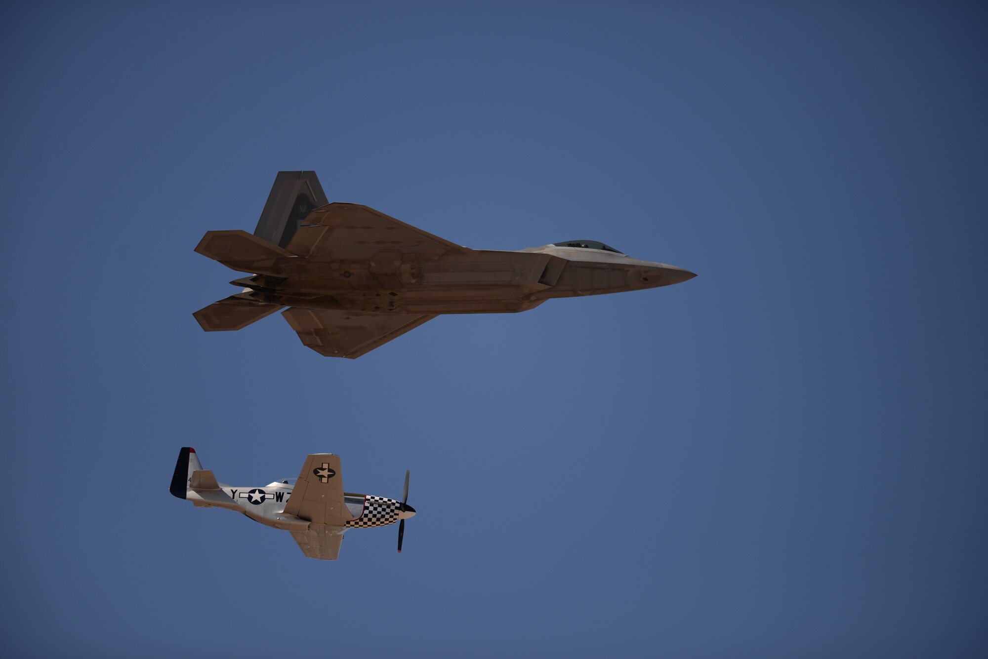 During the annual Heritage Flight Training and Certification course, aircrews practice ground and flight training to enable civilian pilots of historic military aircraft and U.S. Air Force pilots of current fighter aircraft to fly safely in formations together