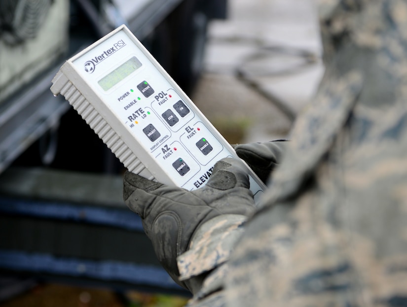 Senior Airman Lauryn Gormaly, 9th Aircraft Communications Maintenance Unit ground communication segment technician, uses a remote to stow an antenna