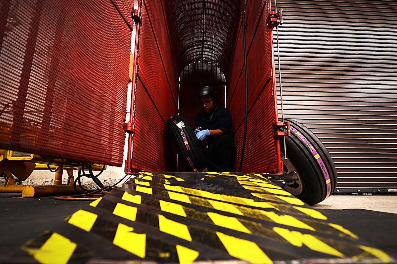 U.S. Air Force Airman 1st Class William Miller, 20th Equipment Maintenance Squadron wheel and tire team member, uses an F-16CM Fighting Falcon bead breaker at Shaw Air Force Base, S.C., Feb. 27, 2018.