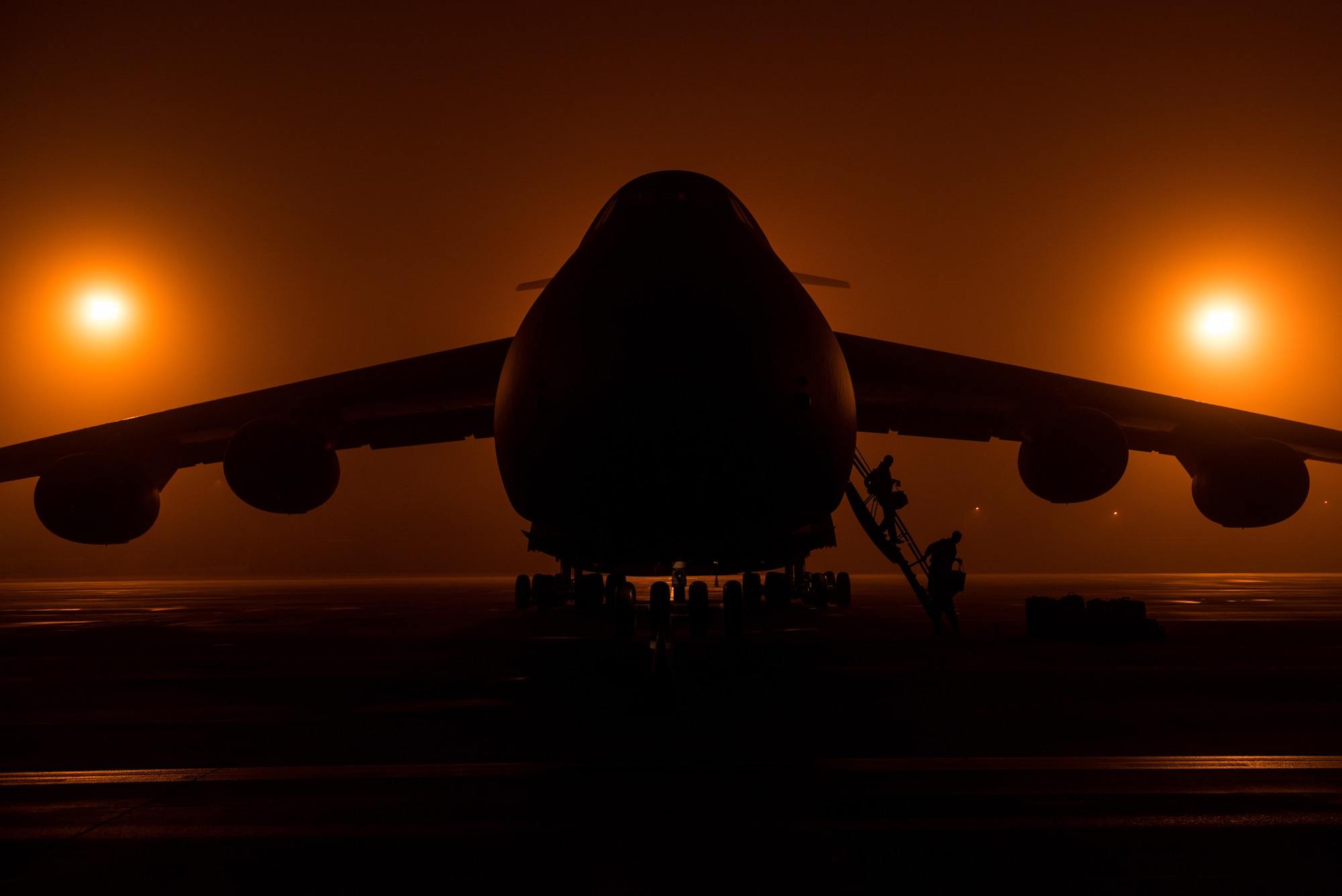 Airmen from the 22nd Airlift Squadron offload from a C-5M Super Galaxy aircraft during a Tuskegee Airmen heritage flight at Killeen-Fort Hood Regional Airport, Texas, Feb. 23, 2018. The flight consisted of an all-black C-5M crew that completed the mission, displayed pride in their heritage and showcased their ability to conduct rapid global mobility in today’s Air Force by delivering U.S. Army helicopters to the Central Command area of responsibility. (U.S. Air Force photo by Master Sgt. Joey Swafford)