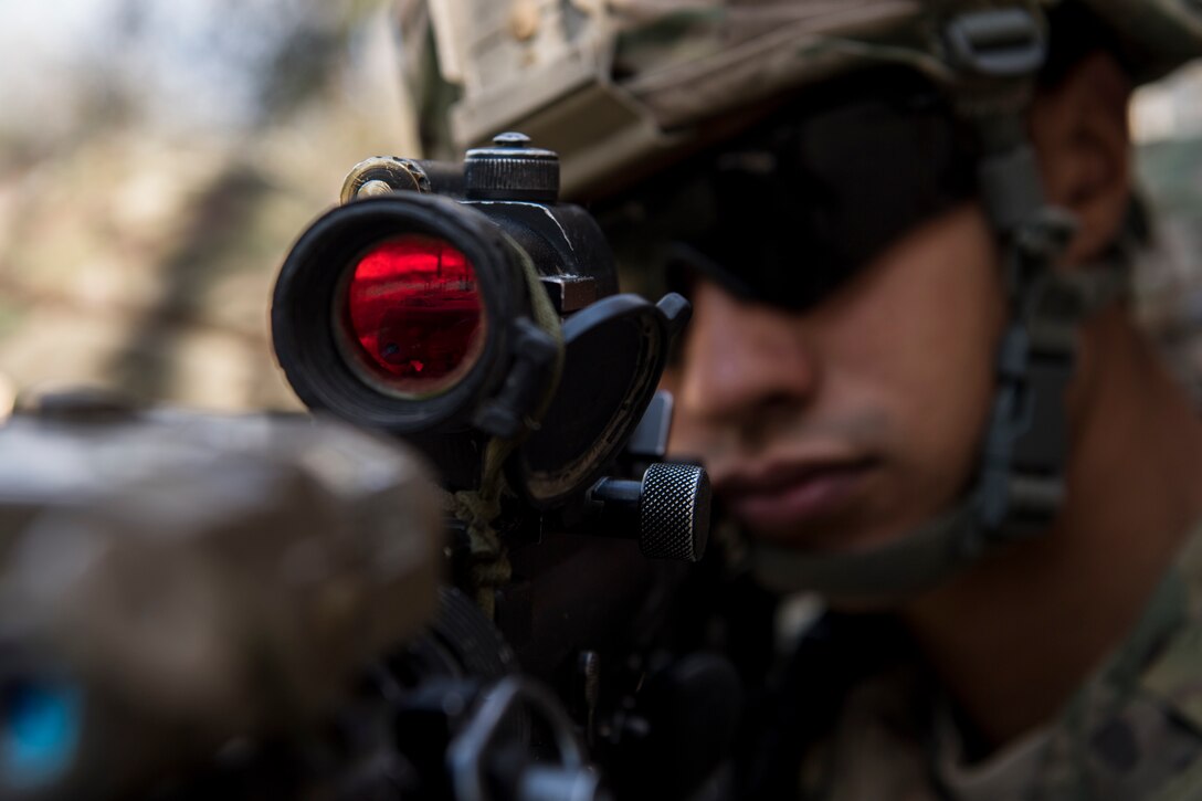 An Airman from the 824th Base Defense Squadron guards an entrance to a building during close-quarters battle training, Feb. 28, 2018, at Moody Air Force Base, Ga. The 820th Base Defense Group welcomed a member of the British Royal Air Force to embed into multiple training situations to help strengthen combined operations between U.S. and British forces. (U.S. Air Force photo by Senior Airman Daniel Snider)