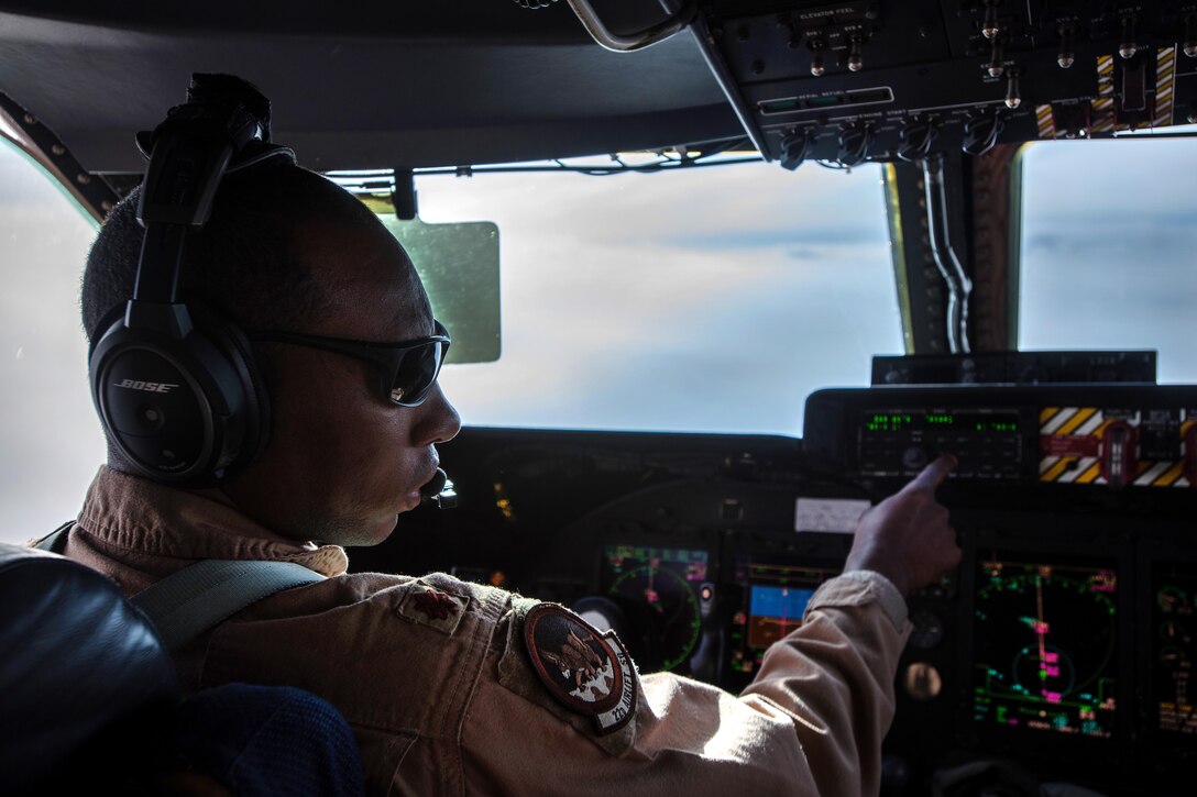 Maj. Calford Morris makes adjustments to a C-5M Super Galaxy aircraft.