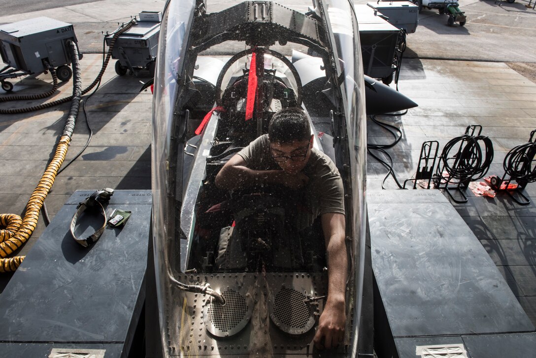 Airman 1st Class Kyle Segura, an F-15E Strike Eagle maintainer assigned to the 332d Expeditionary Maintenance Squadron, inspects the cockpit ejection system during phase maintenance March 1, 2018, at an undisclosed location. Phase maintenance typically takes seven to ten days, allowing maintainers to break down the jet and inspect every aspect of its complex systems. (U.S. Air Force photo by Staff Sgt. Joshua Kleinholz)
