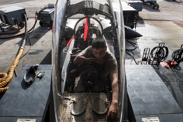 Airman 1st Class Kyle Segura, an F-15E Strike Eagle maintainer assigned to the 332d Expeditionary Maintenance Squadron, inspects the cockpit ejection system during phase maintenance March 1, 2018, at an undisclosed location. Phase maintenance typically takes seven to ten days, allowing maintainers to break down the jet and inspect every aspect of its complex systems. (U.S. Air Force photo by Staff Sgt. Joshua Kleinholz)