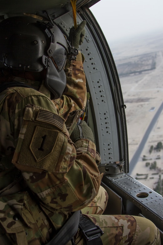 Staff Sergeant Jackie Edwards, crew chief, Alpha Company, “Task Force Voodoo”, 1st Assault Helicopter Battalion, 244th Aviation Regiment, Louisiana National Guard during a flight over Camp Buehring, Kuwait, Feb. 27, 2018. Edwards, a Ponchatoula, Louisiana, native, is the first African-American female crew chief in the LANG.