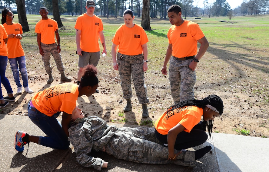 Two students from West Lowndes High School participate in a self-aid buddy care demonstration Feb. 23, 2018, on Columbus Air Force Base, Mississippi. The students completed an obstacle course consisting of five different stations which taught them different ways to stay healthy or safe. (U.S. Air Force photo by Airman 1st Class Beaux Hebert)