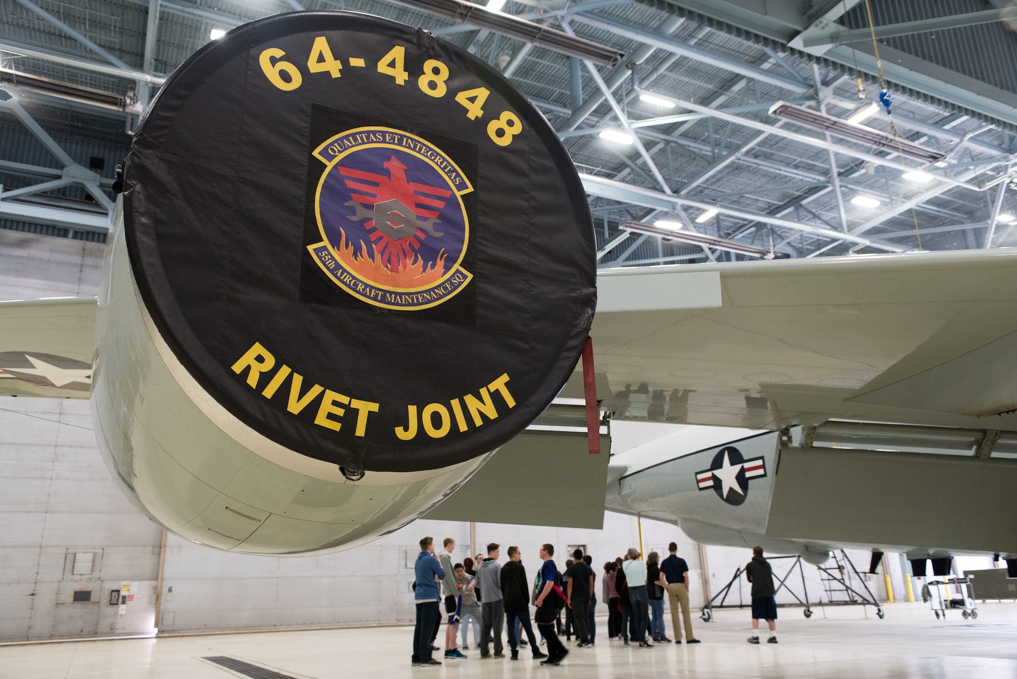 Students from Bellevue East High School touring the 55th Maintenance Squadron visit a RC-135 Rivet Joint aircraft Feb. 27, 2018 at Offutt Air Force Base, Nebraska. The students have recently been studying the science of flight, so many of the tour stops allowed them to gain a deeper understanding of what goes into keeping aircraft ready for flight. (U.S. Air Force photo by Senior Airman Jacob Skovo)