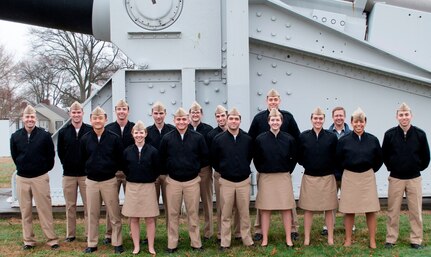 IMAGE: DAHLGREN, Va. (Feb. 23, 2018) - University of Virginia Naval Reserve Officers Training Corps (ROTC) Midshipmen pause in front of a U.S. Navy 16-inch battleship gun on the parade field during their tour of Naval Surface Warfare Center Dahlgren Division (NSWCDD). Lt. Aaron Brotman, assistant professor of naval science for the university's ROTC program, left, and Chris Hodge, NSWCDD director of technical development, are pictured with the 14 Midshipmen in front of a gun that served aboard USS New Jersey (BB-62) before it was retired to Naval Support Facility Dahlgren. Navy scientists and engineers briefed the future naval officers on technologies and facilities such as warfare analysis, laser weapon testing and development, and MOATS - the Maginot' Open Air Test Site. MOATS has been specifically designed for testing the radio frequency susceptibility of electronic equipment to potential high power microwave weapon systems. The Midshipmen saw how NSWCDD engineers conduct lethality work impacting the evaluation of high energy laser technology in addition to the design and development process required to integrate future laser weapon systems in various platforms. NSWCDD scientists and engineers discussed various aspects of electrical and computer engineering, including systems the ROTC Midshipmen would be interacting with as Navy and Marine Corps officers.