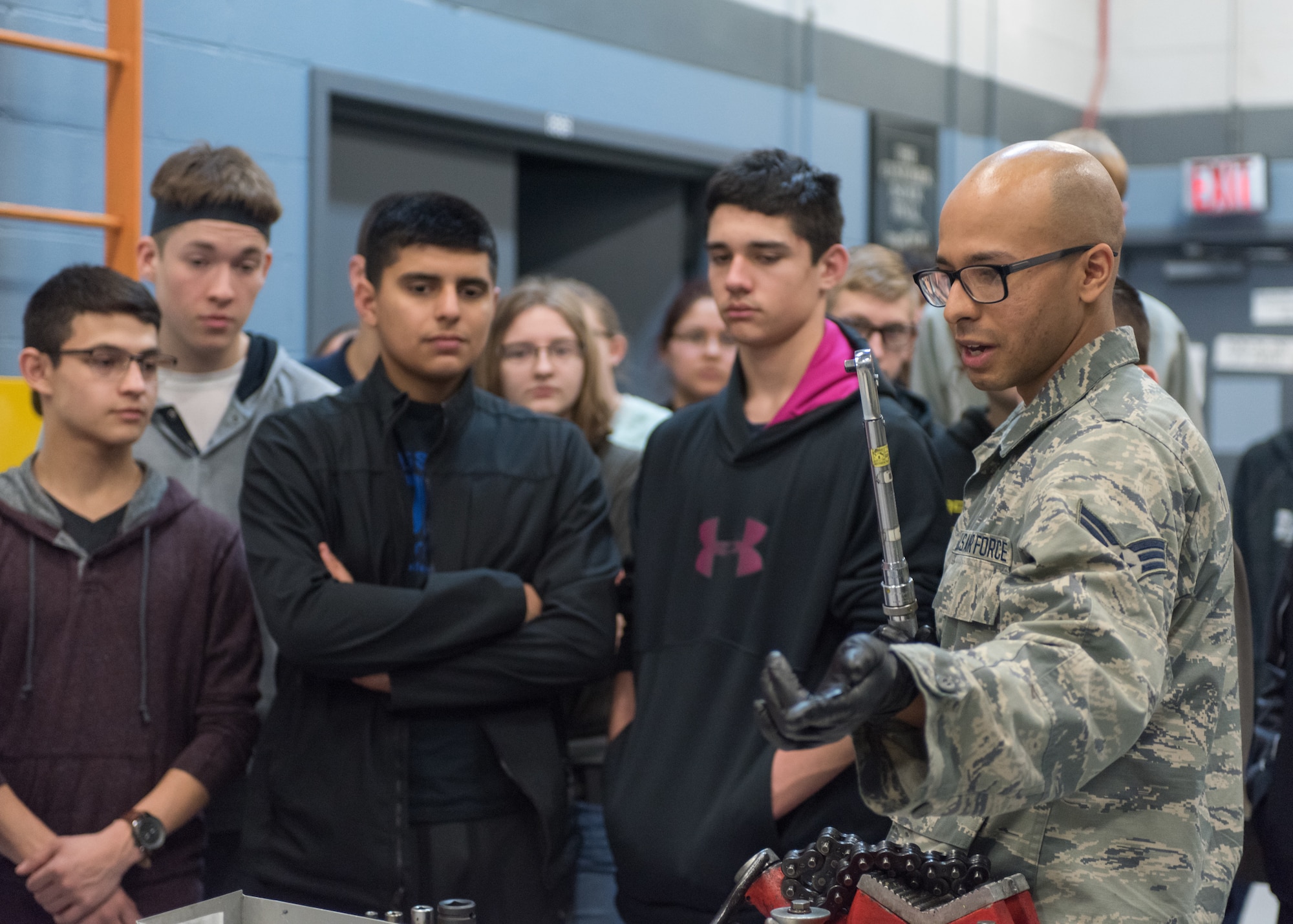 Senior Airman Angel Sanchez, 55th Maintenance Squadron Consolidated Support Flight aircraft hydraulics journeyman speaks to students from Bellevue East High School Feb. 27, 2018 at Offutt Air Force Base, Nebraska. The tour highlighted the roles that both military and civilian Airmen hold here and what it takes to keep Offutt AFB’s aircraft mission ready. (U.S. Air Force photo by Senior Airman Jacob Skovo)