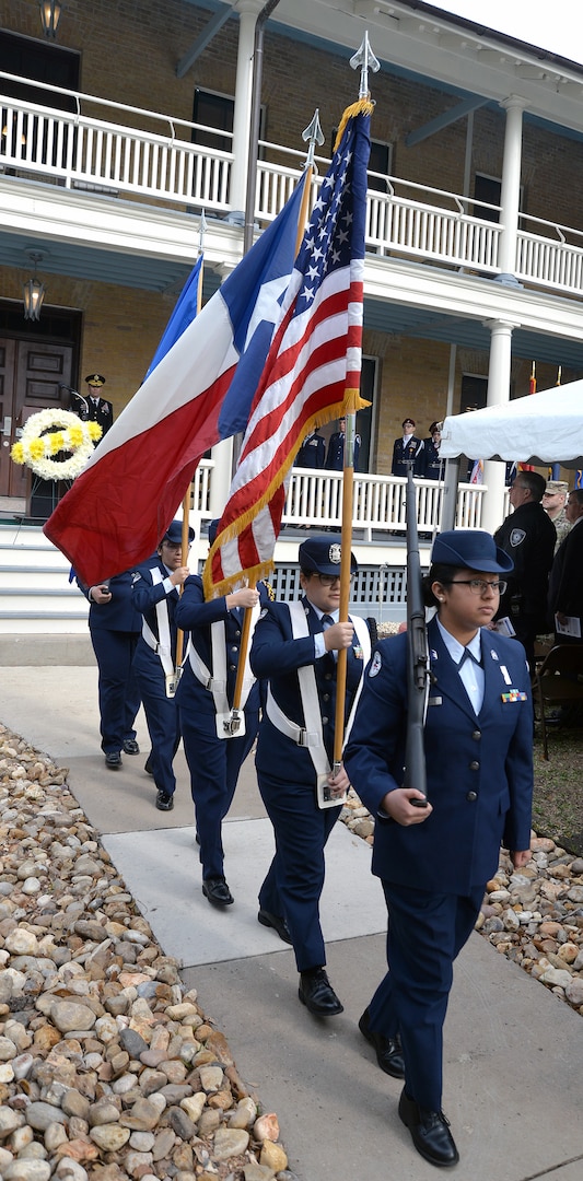 Members of the Pearsall High School Air Force Junior ROTC Color Guard depart with the colors during the 108th anniversary celebration of the first military flight made by Army Lt. Benjamin Foulois at Joint Base San Antonio-Fort Sam Houston on March 2, 1910. The ceremony took place at the Foulois House on JBSA-Fort Sam Houston March 2.