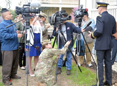 Lt. Gen. Jeffrey Buchanan (right), commanding general of U.S. Army North (Fifth Army), at JBSA-Fort Sam Houston, is interviewed by members of several San Antonio television stations after the ceremony honoring Lt. Benjamin Foulois, who made the first military flight on Marc 2, 1010, at Fort Sam Houston.