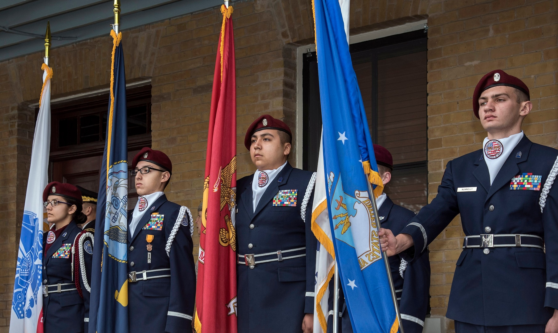 Members of the Pearsall High School Air Force Junior ROTC present the colors of each military service during a medley of armed force songs at the end of the celebration of the 108th anniversary of the first military flight made by Army Lt. Benjamin Foulois at Joint Base San Antonio-Fort Sam Houston on March 2, 1910.