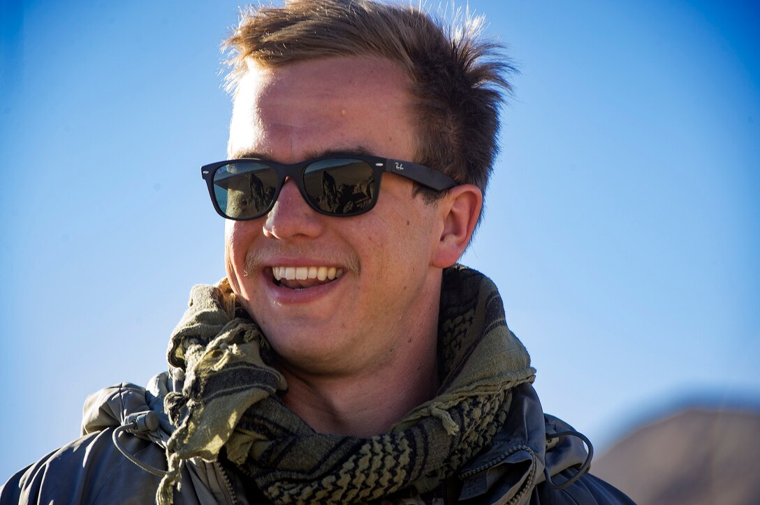 Airman 1st Class Christopher Beeson, 3d Air Support Operations Group Tactical Air Control Party specialist, smiles prior to co-directing an air strike during a rotation at Ft. Irwin, California’s National Training Center, Feb. 20, 2018. During the month-long rotation, 93d Air Ground Operations Wing units embedded with approximately 4,000 soldiers in the largest force-on-force live-fire exercise in the world. The 93d AGOW provided tactical air control party support to enhance interoperability for major combat operations downrange. (U.S. Air Force photo by Senior Airman Greg Nash)