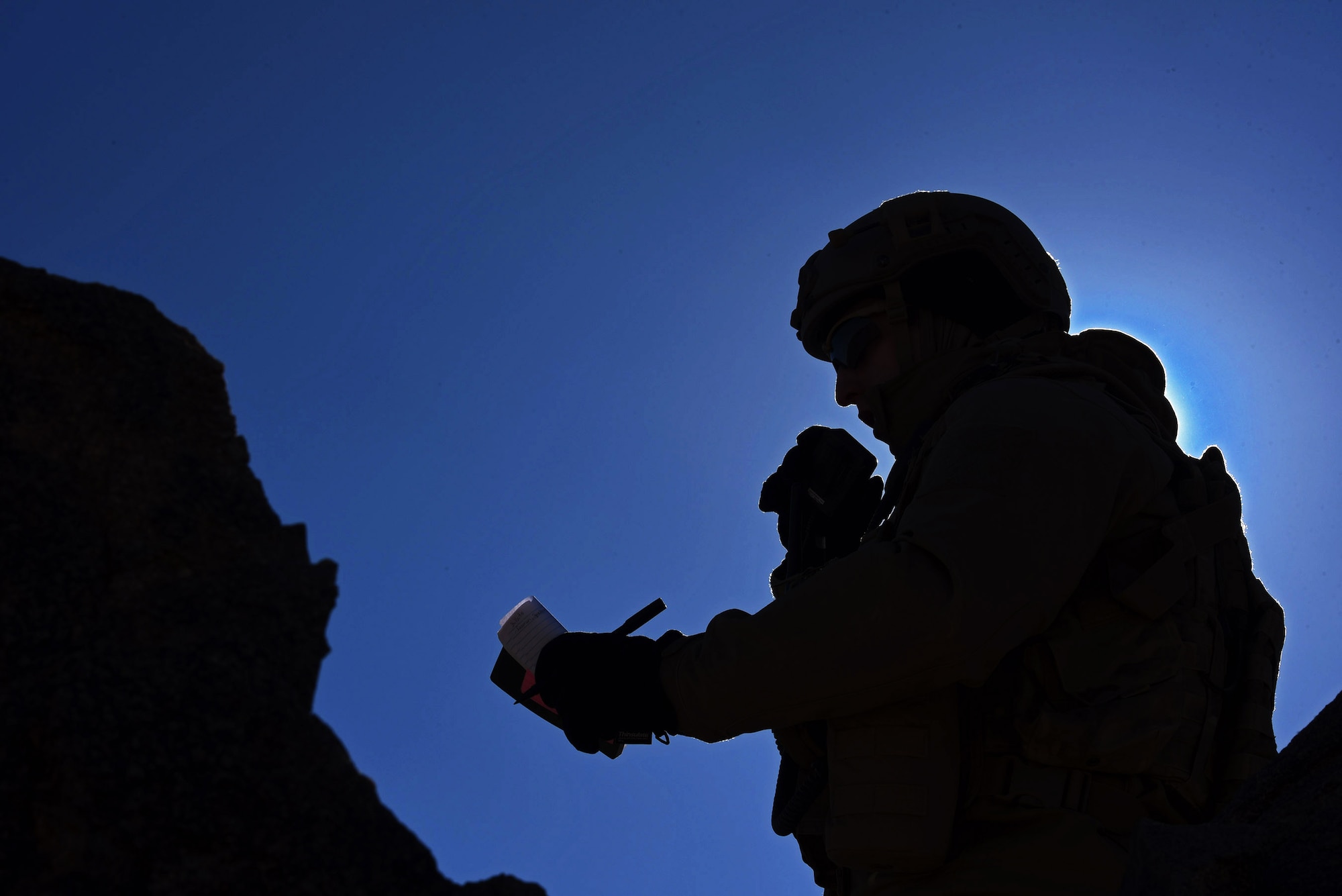 Senior Airman Joseph Schwartz, 14th Air Support Operations Squadron Joint Terminal Attack Controller, communicates target locations to pilots during a close-air support exercise as part of a Ft. Irwin, Califor., National Training Center rotation, Feb. 22, 2018. During the month-long rotation, 93d Air Ground Operations Wing units embedded with approximately 4,000 soldiers in the largest force-on-force live-fire exercise in the world. The 93d AGOW provided tactical air control party support to enhance interoperability for major combat operations downrange. (U.S. Air Force photo by Senior Airman Greg Nash)