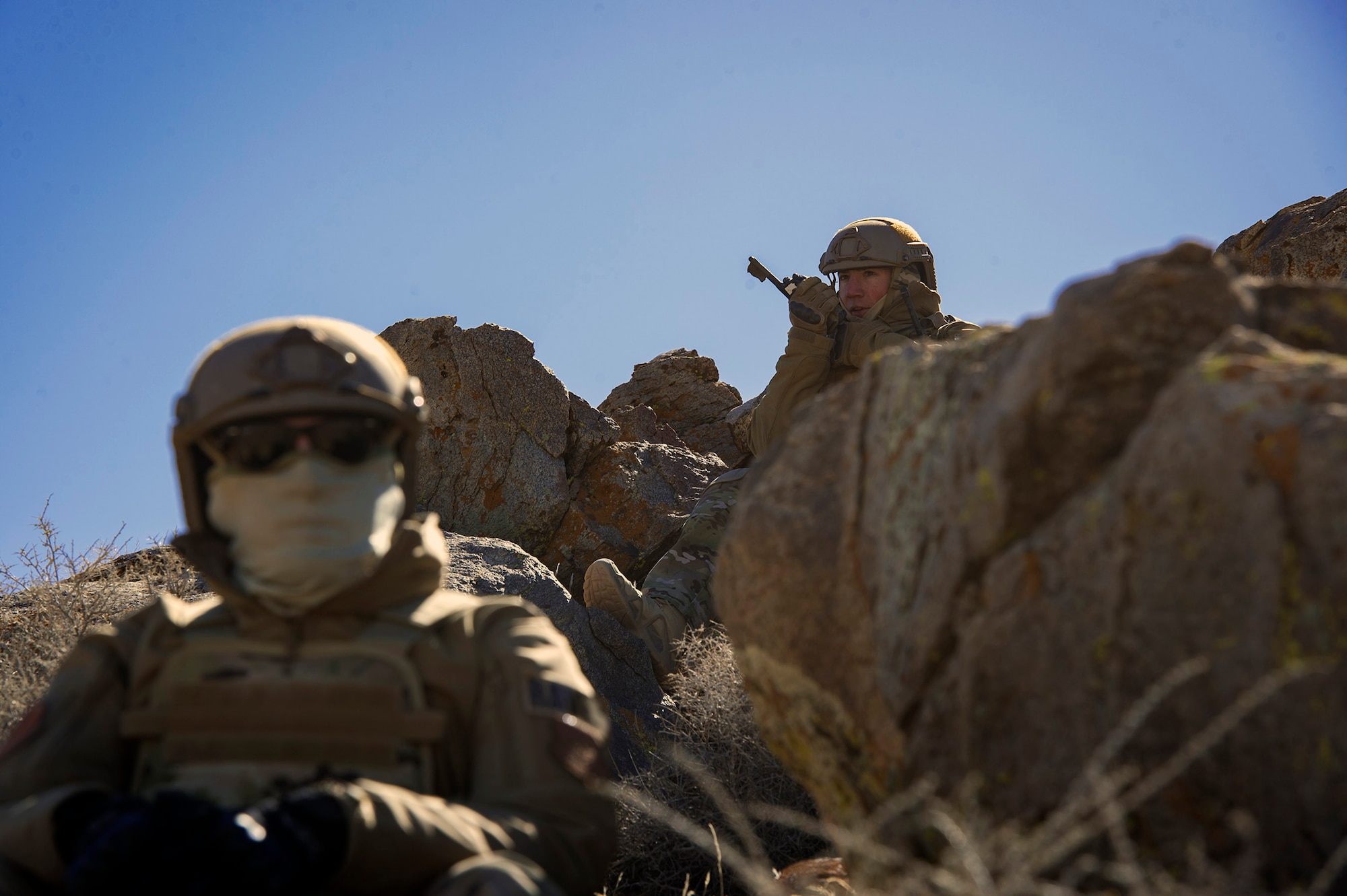 Staff Sgt. Michael Laird, National Training Center Joint Terminal Attack Controller observer, coach and trainer, radios in moving-target threats to pilots during a live-bomb exercise as part of Ft. Irwin, California’s NTC pre-deployment rotation, Feb. 22, 2018. During the month-long rotation, 93d Air Ground Operations Wing units embedded with approximately 4,000 soldiers in the largest force-on-force live-fire exercise in the world. The 93d AGOW provided tactical air control party support to enhance interoperability for major combat operations downrange. (U.S. Air Force photo by Senior Airman Greg Nash)