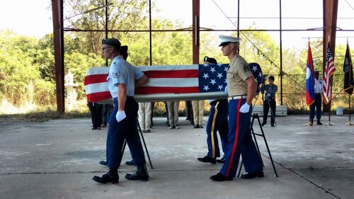 Tech. Sgt. Garrett Wright, 22nd Operations Support Squadron Survival, Evasion, Resistance and Escape and Personnel Recovery specialist, and three other service members carry a casket during a repatriation ceremony.