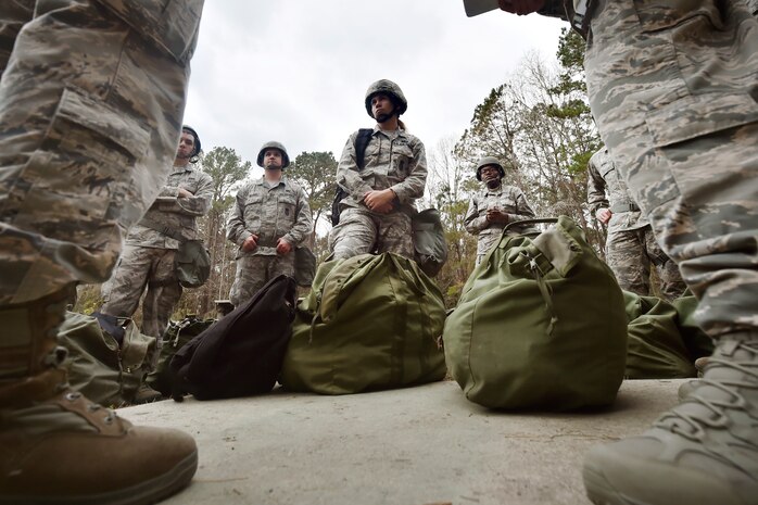 Airmen listen to an ability to survive and operate training briefing as part of Mobility Exercise Bold Eagle Feb. 28, at Joint Base Charleston, S.C.