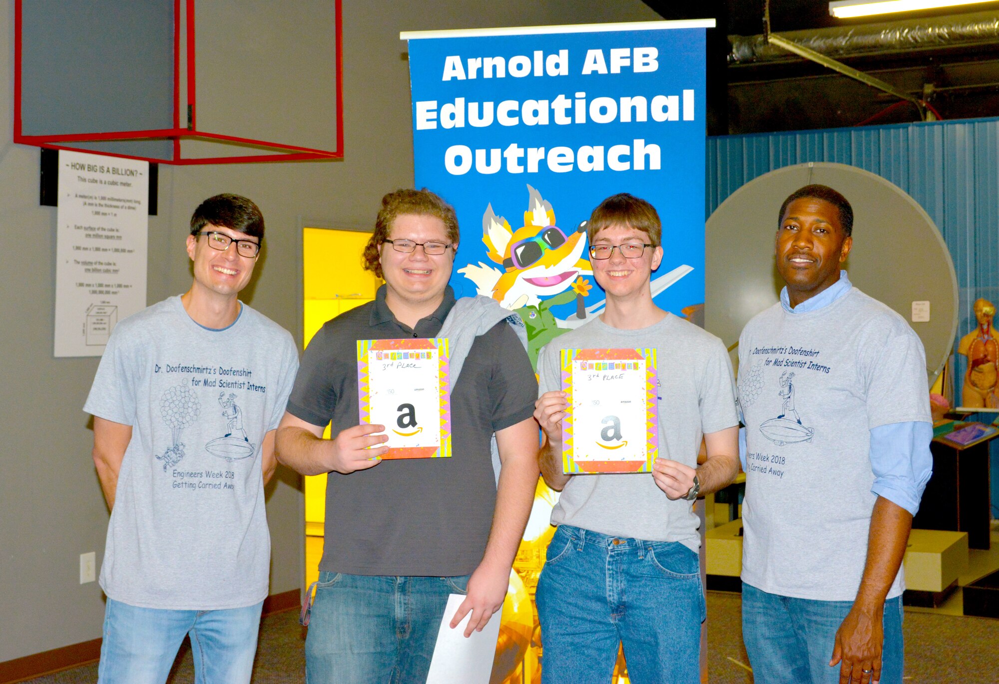 During the Arnold Air Force Base Engineers Week Student Design Competition Feb. 20 at the Hands-on Science Center, Tullahoma, Kendall Purdom and Timothy Barlow from Community High School, Bedford County, take third place in the competition. Twenty-one, two-student teams were challenged to construct a vehicle, from provided scraps and materials, which would travel through the air while also moving around obstacles. Pictured from left is Arnold AFB engineer Rylan Cox, Purdom, Barlow and Arnold engineer Jeremy Morris. (Courtesy photo)