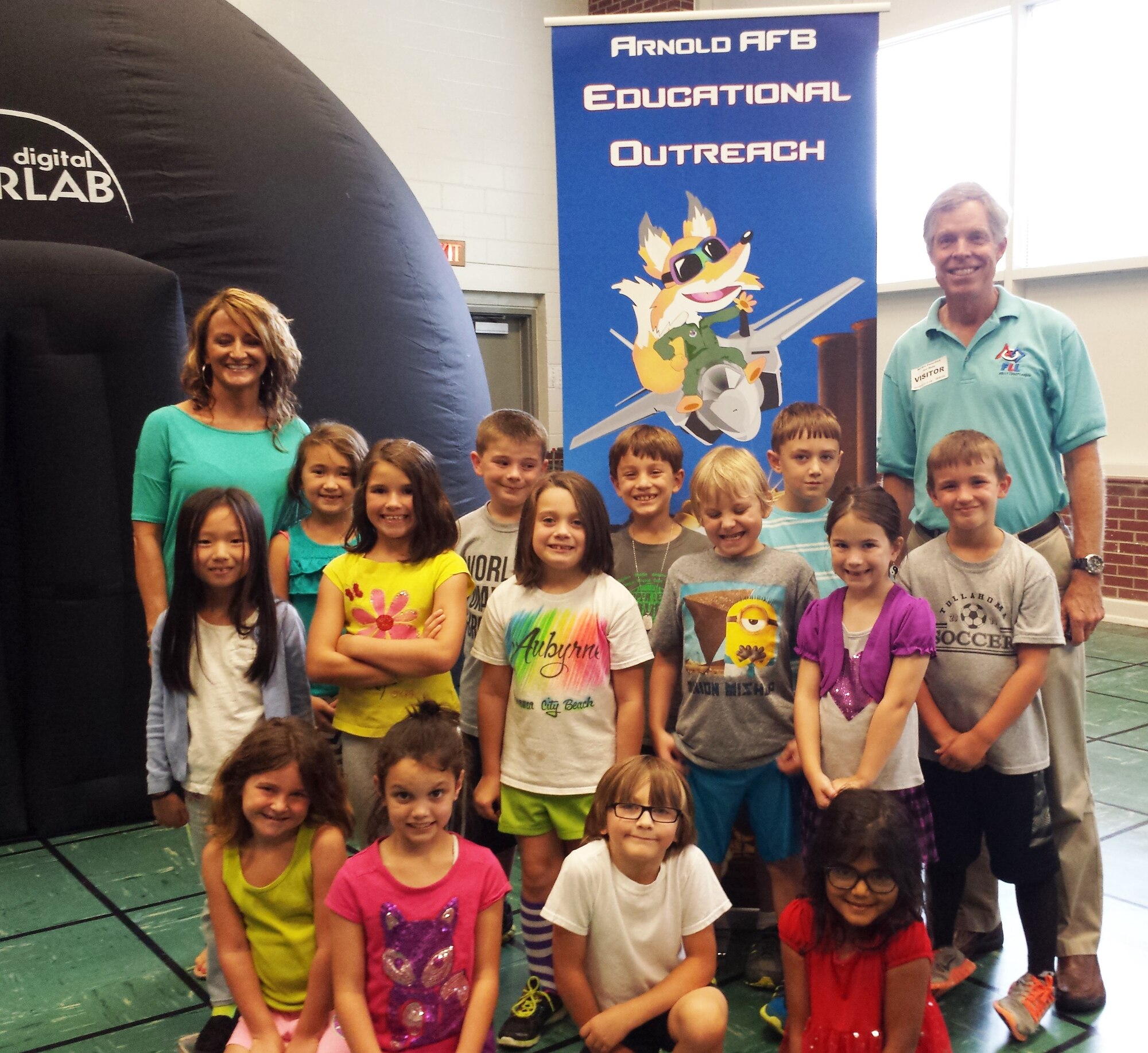 Jere Matty (far right), Arnold Air Force Base Science, Technology, Engineering and Mathematics Center coordinator, records history with Bel Aire Elementary School in Tullahoma by taking a photo after speaking to the group about planets and stars using the Discovery Dome. The Discovery Dome is one of the learning tools that will be transferred to the Hands-on Science Center in Tullahoma through and Air Force STEM Program partnership. (Courtesy photo)