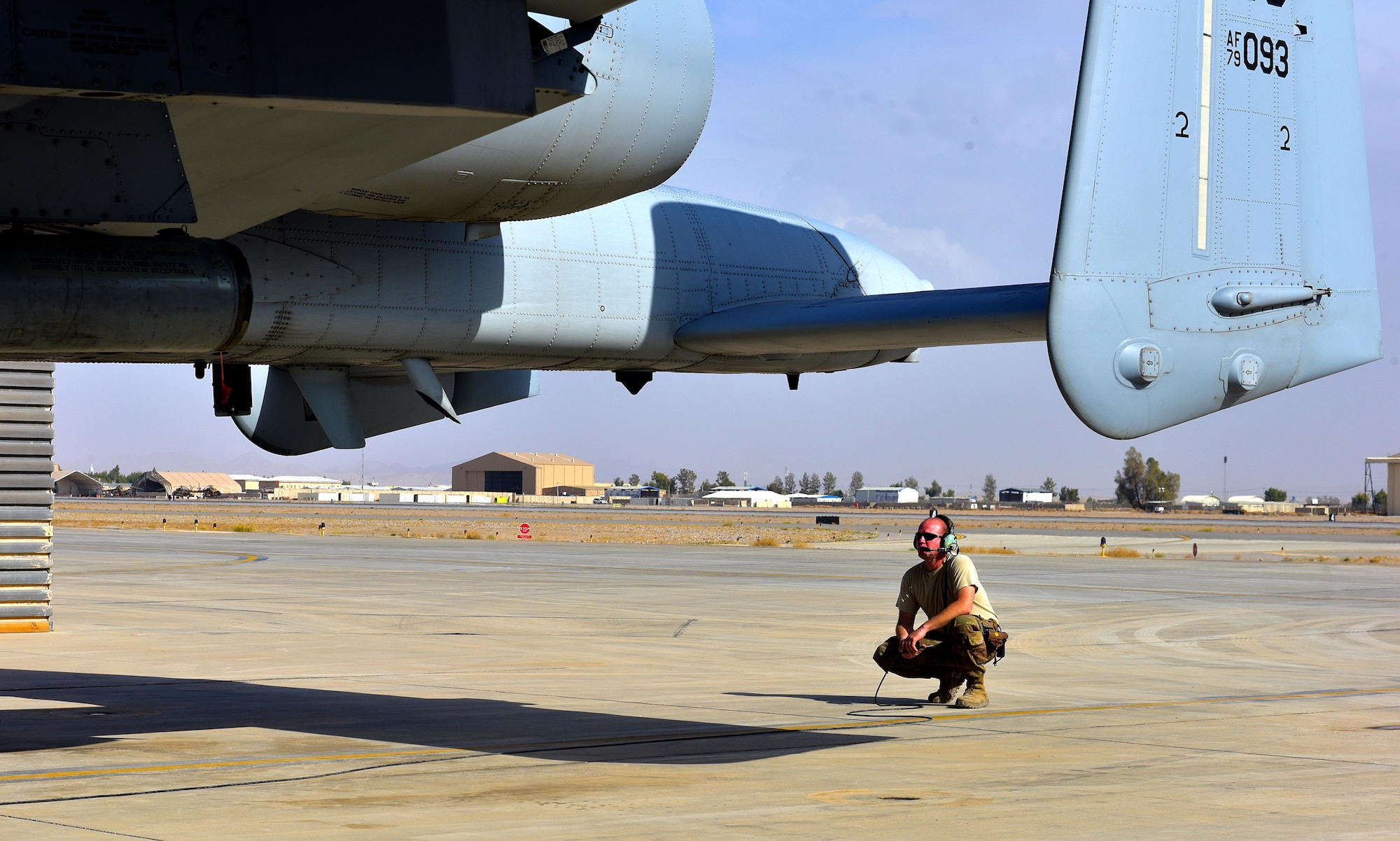 Master Sgt. John Tischhauser, 303rd Expeditionary Fighter Squadron production expeditor, performs a preflight inspection on an A-10 Thunderbolt II at Kandahar Airfield, Afghanistan, Feb. 27, 2018.